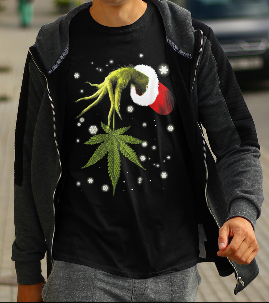 Grinch Hand Holding Cannabis Leaf With Santa Hat And Snowflakes T-Shirt