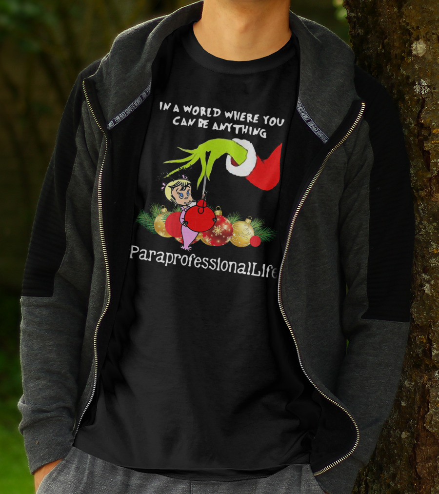 In A World Where You Can Be Anything Hand Grinch Holding Ornaments #ParaprofessionalLife T-Shirt