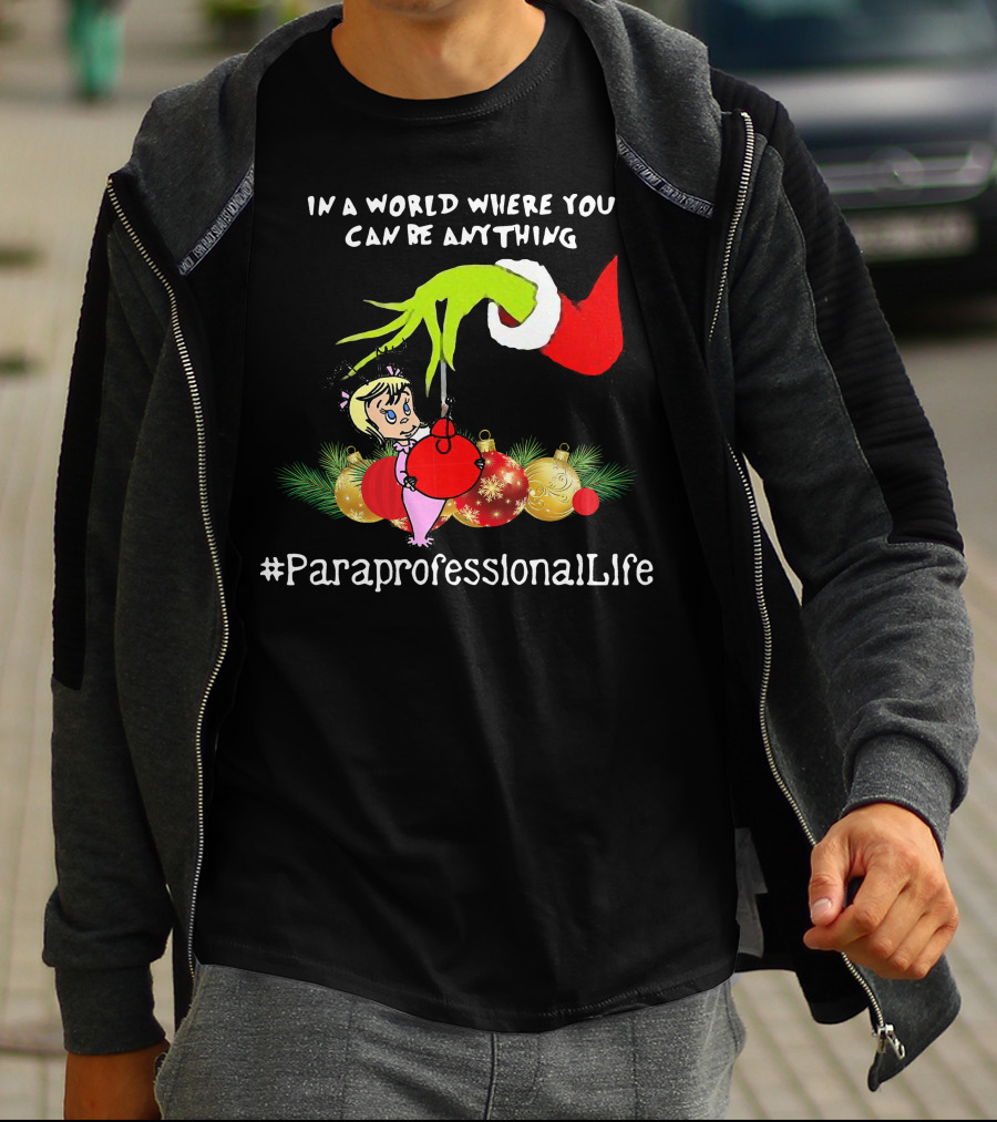 In A World Where You Can Be Anything Hand Grinch Holding Ornaments #ParaprofessionalLife T-Shirt
