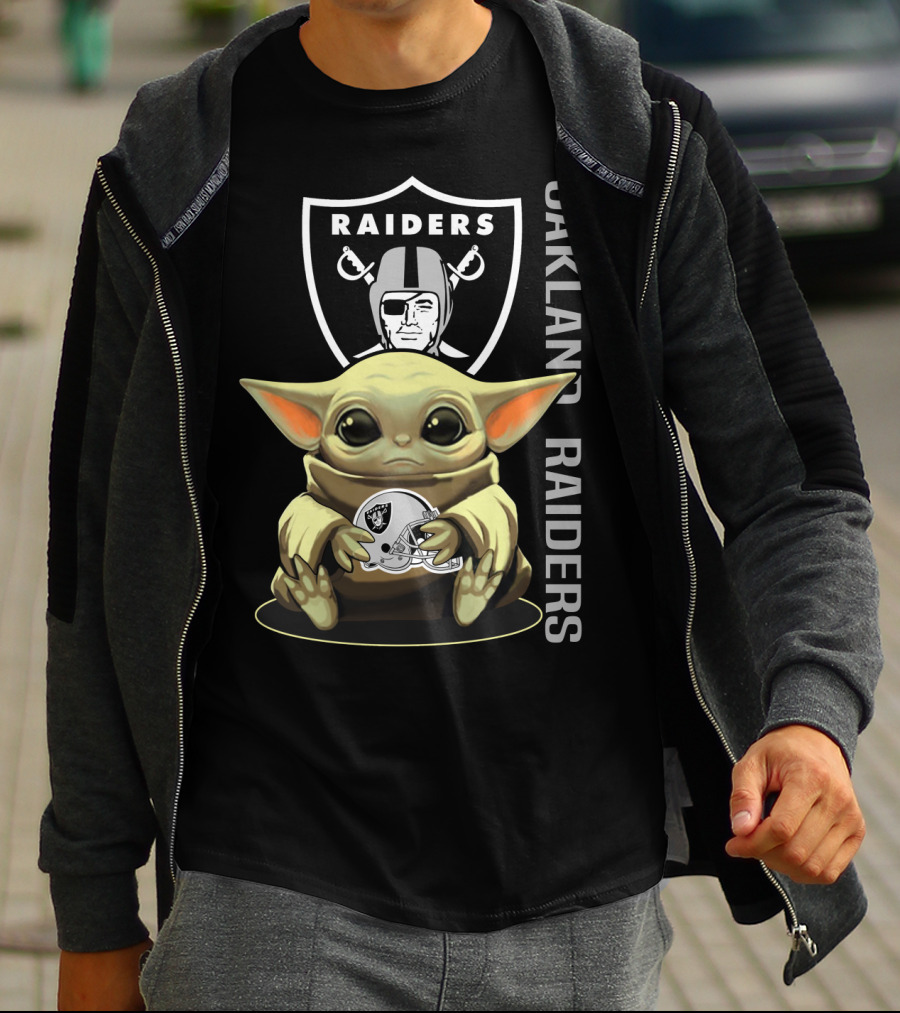 Baby Yoda Holding Oakland Raiders Helmet With Raiders Logo In Background T-Shirt