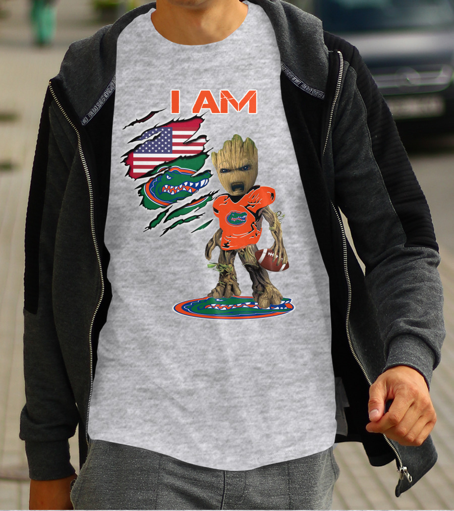 I Am Gators Baby Groot Holding Football With American Flag And Florida Gators T-Shirt