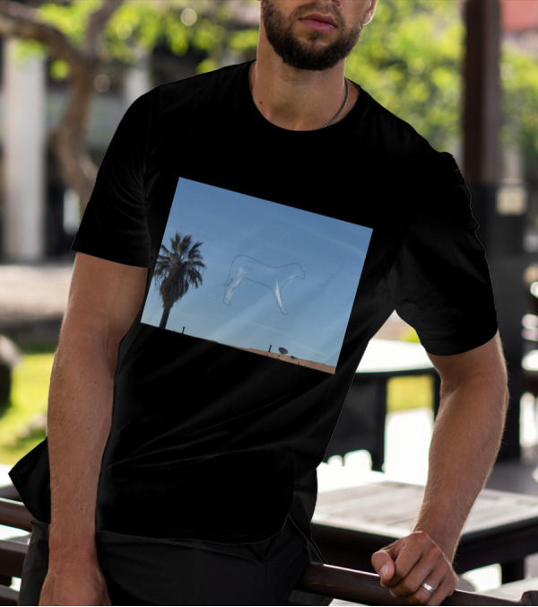 I See A Dog Outline Floating In The Blue Sky Beside A Palm Tree T-Shirt