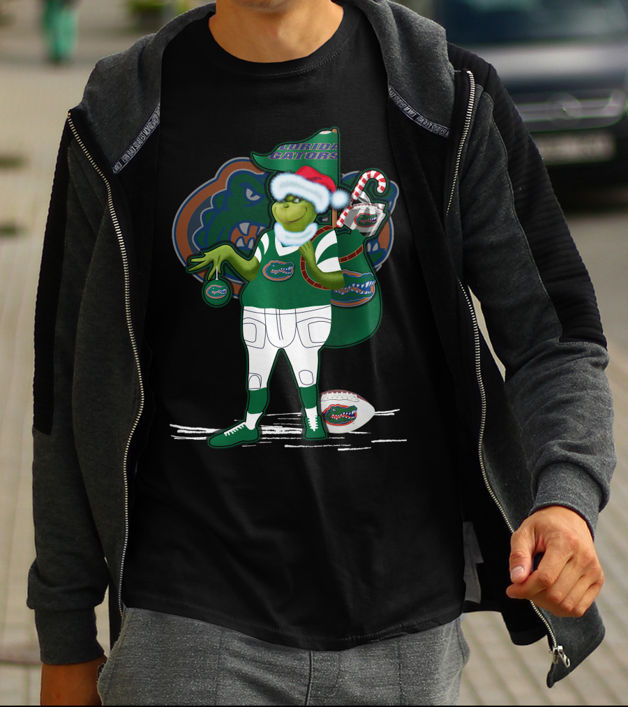 Grinchxmas Wearing Santa Hat Florida Gators With Gator Logo And Candy Cane T-Shirt