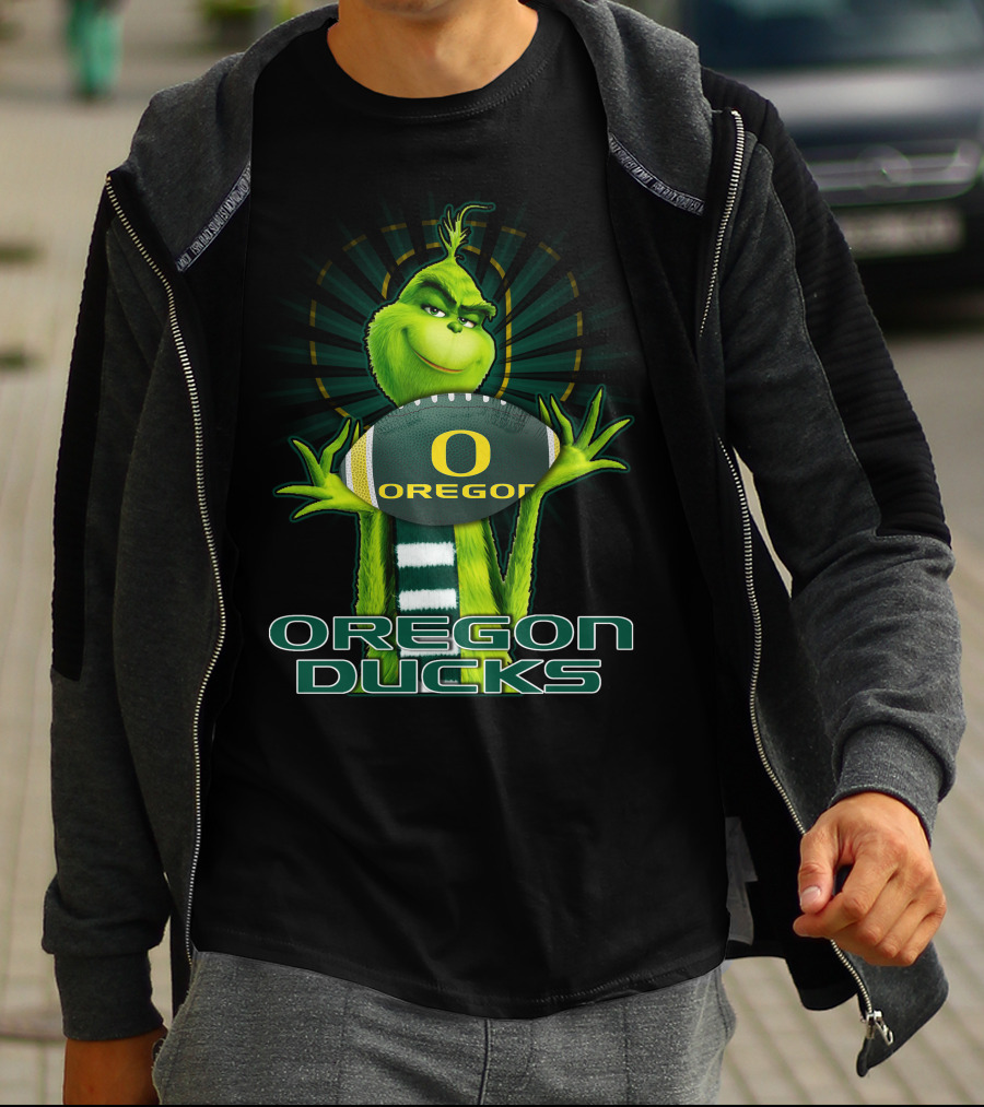Grinch Holding Oregon Ducks Football T-Shirt