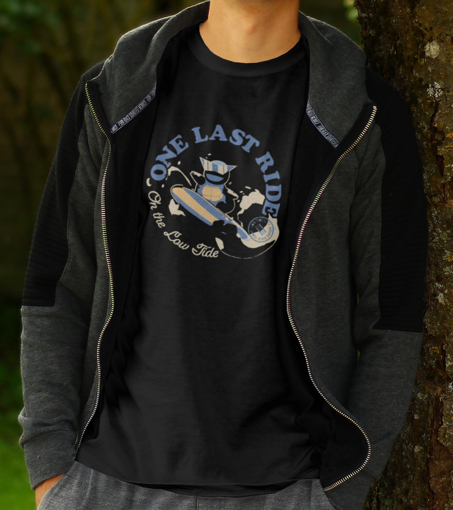 Surfing Adventure With Blue Masked Figure And Iconic Board 'One Last Ride On The Low Tide' T-Shirt