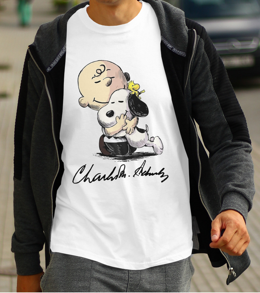 Snoopy And Charlie Brown Hugging By Charles M. Schulz T-Shirt