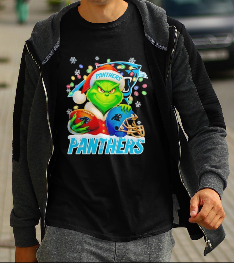 Grinch Santa Hat Holding Carolina Panthers Football And Helmet Merry Christmas T-Shirt