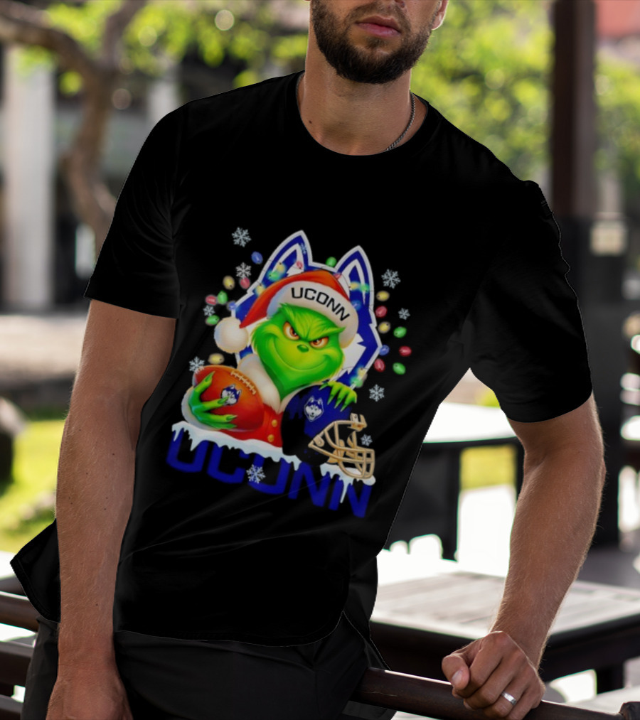 Grinch Wearing Santa Hat With UConn Huskies Football And Helmet Merry Christmas T-Shirt