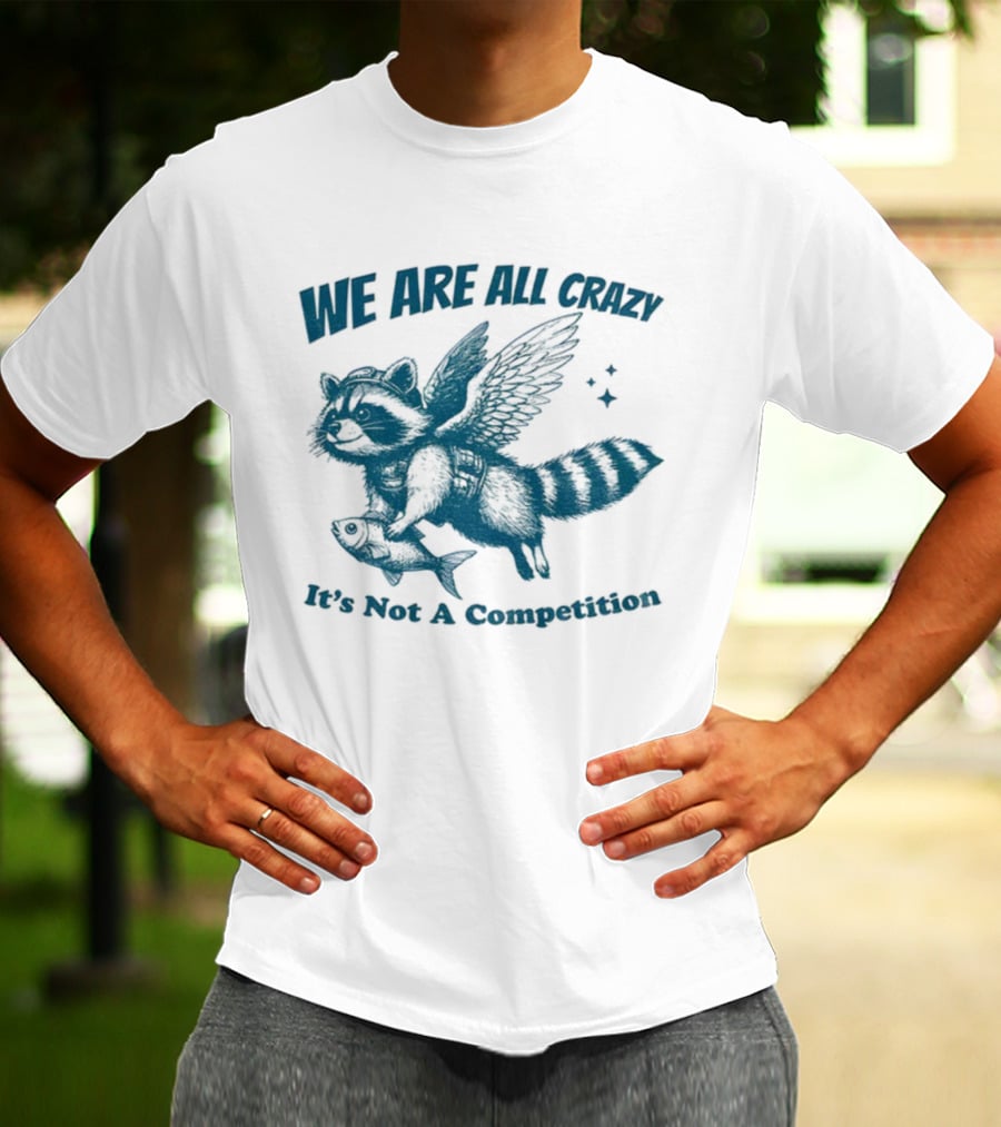 Raccoon With Wings Holding Fish We Are All Crazy It's Not A Competition T-Shirt