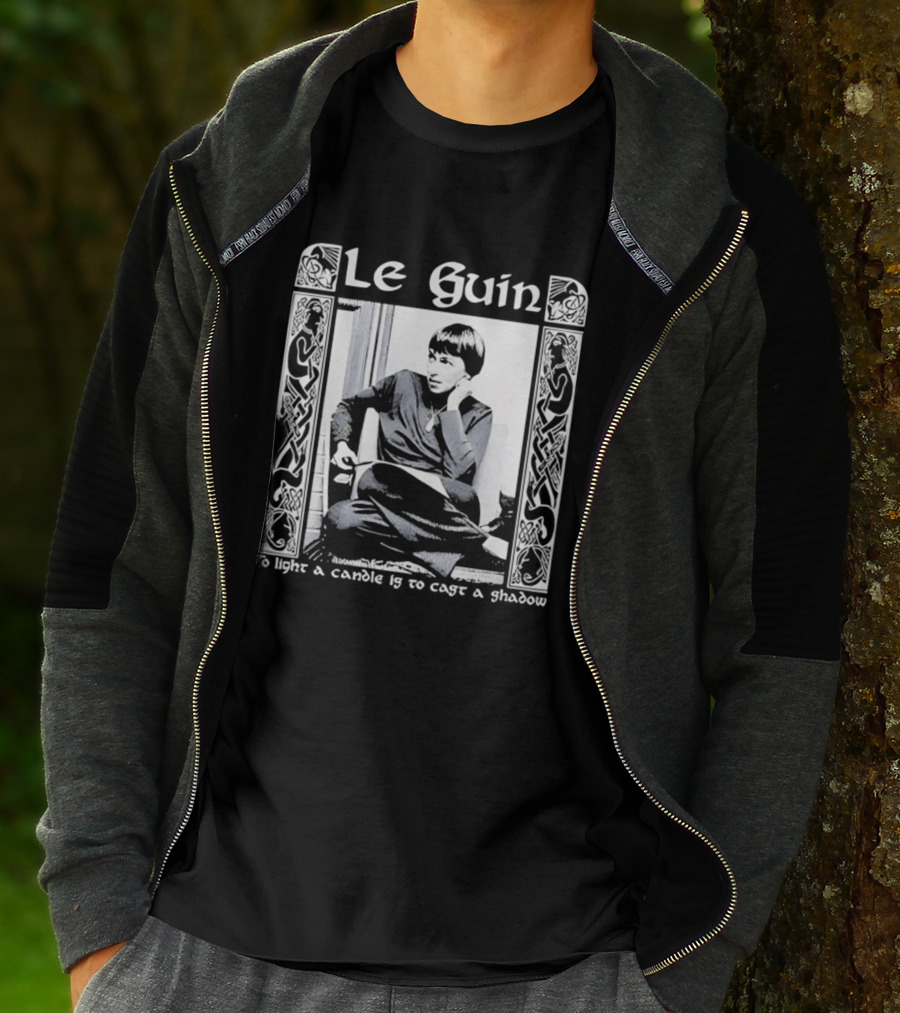 Le Guin To Light A Candle Is To Cast A Shadow T-Shirt