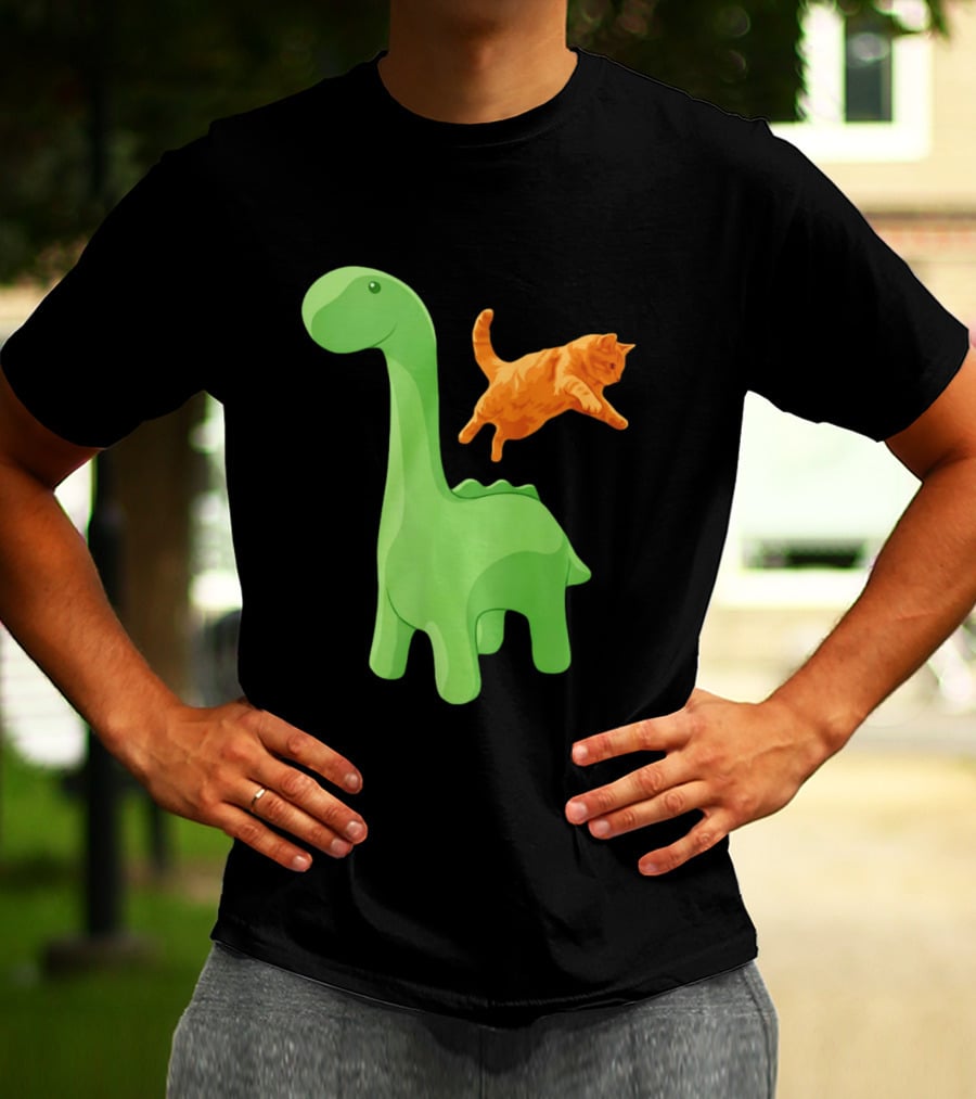 Cat Jumping Over Green Dinosaur Cartoon Image T-Shirt