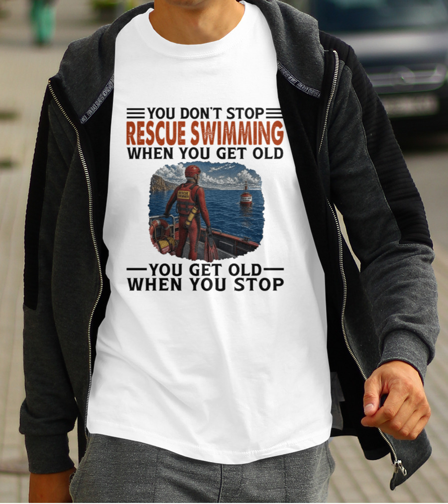 You Don't Stop Rescue Swimming When You Get Old You Get Old When You Stop Rescue Swimmer Standing On Boat Near Lighthouse T-Shirt
