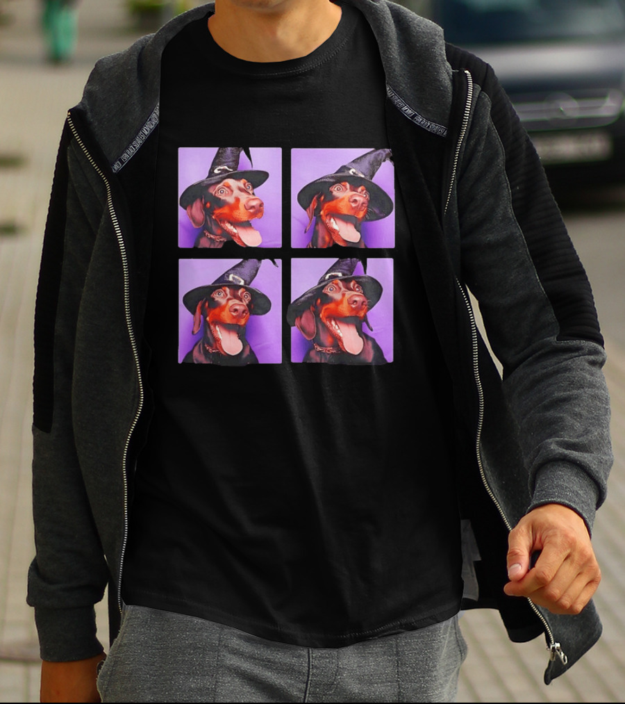 Doberman Pinscher In Witch Hat For Halloween With Purple T-Shirt