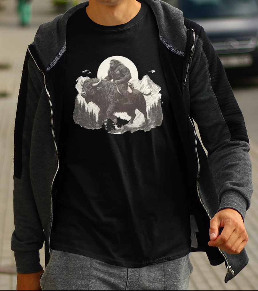 Blurry Creatures Bigfoot Riding Buffalo With Mountains And Moon In Background T-Shirt