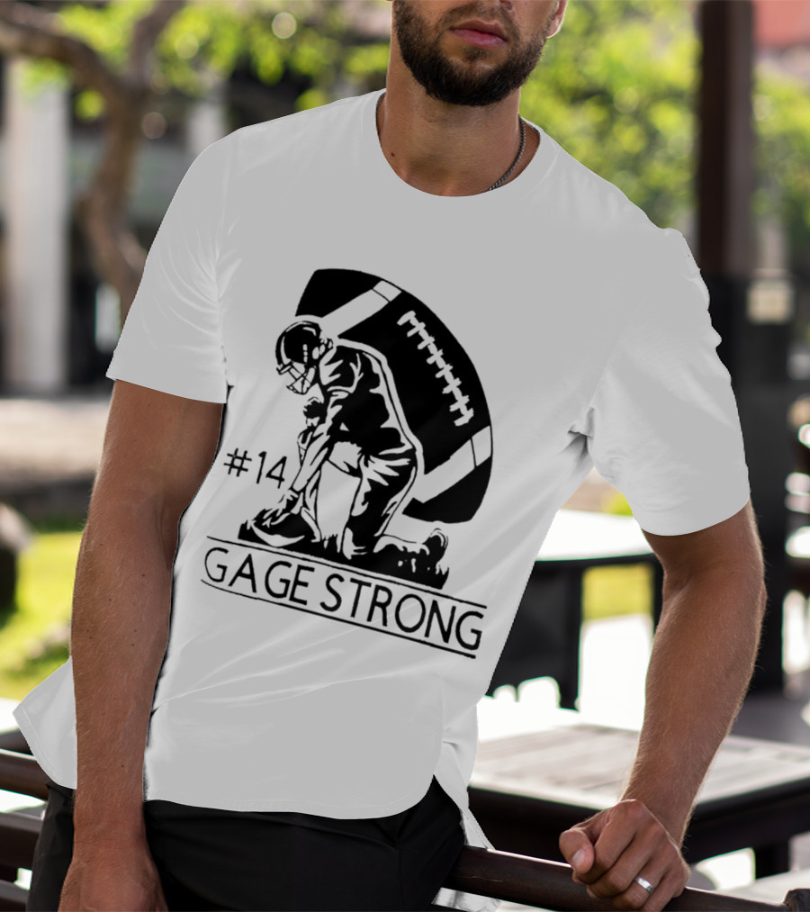 Gage Strong #14 Football Player Kneeling In Front Of Large Football T-Shirt