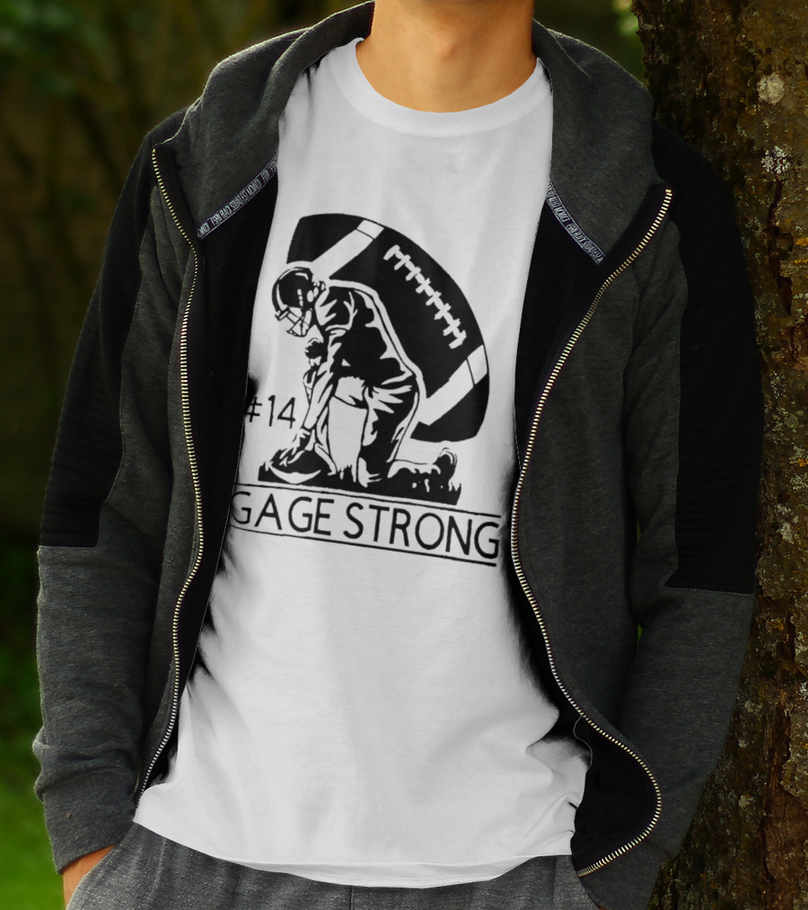 Gage Strong #14 Football Player Kneeling In Front Of Large Football T-Shirt