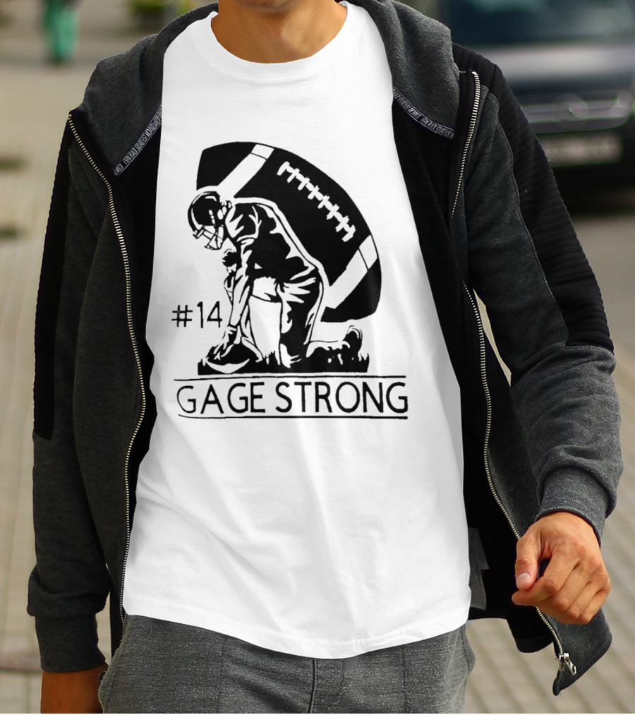 Gage Strong #14 Football Player Kneeling In Front Of Large Football T-Shirt