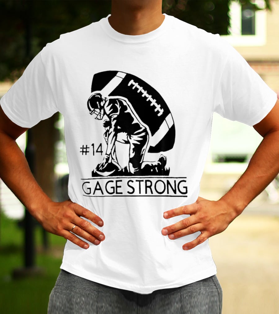 Gage Strong #14 Football Player Kneeling In Front Of Large Football T-Shirt