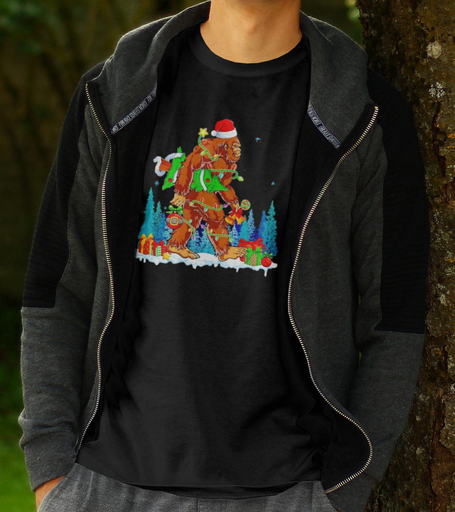 Bigfoot Santa Hugging Christmas Tree With Gifts And Snow Scene T-Shirt