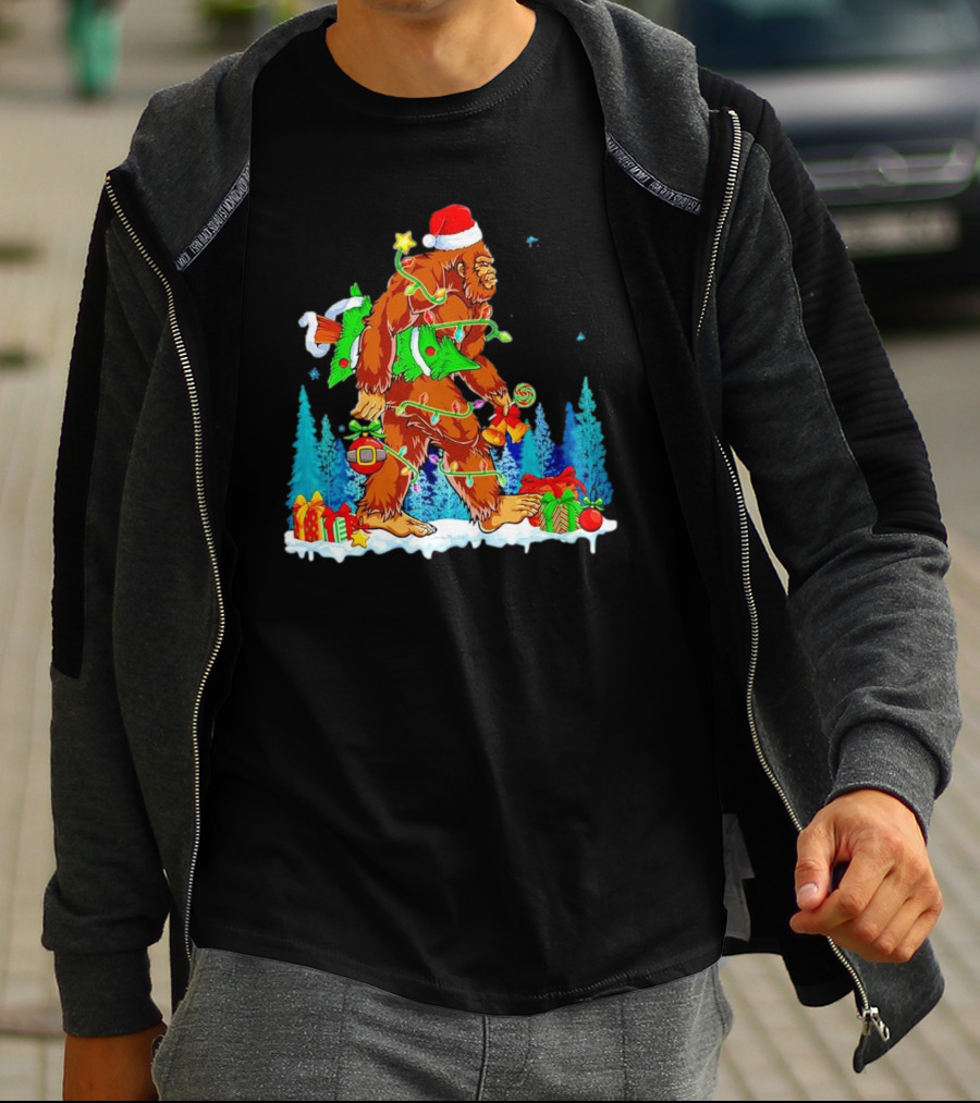 Bigfoot Santa Hugging Christmas Tree With Gifts And Snow Scene T-Shirt