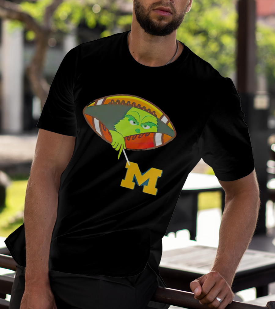 Grinch Peeking From Football Over Michigan Wolverines T-Shirt