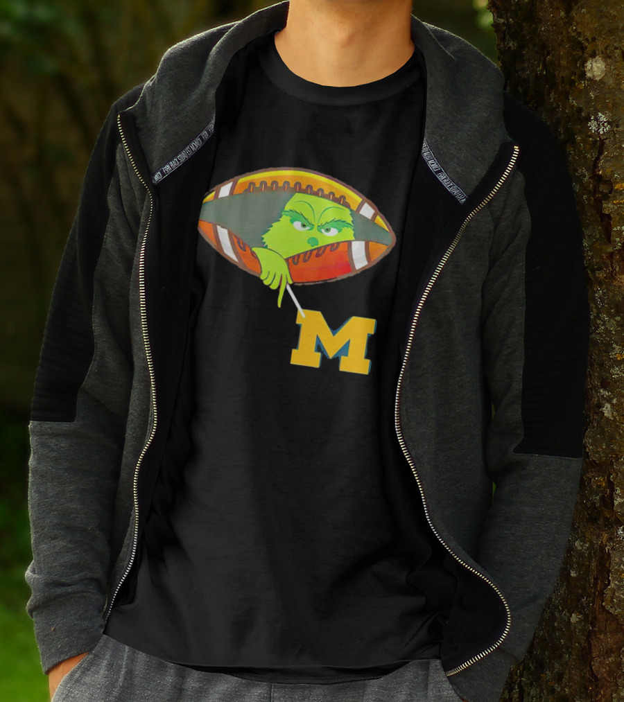 Grinch Peeking From Football Over Michigan Wolverines T-Shirt