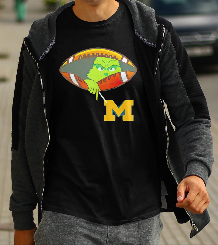Grinch Peeking From Football Over Michigan Wolverines T-Shirt