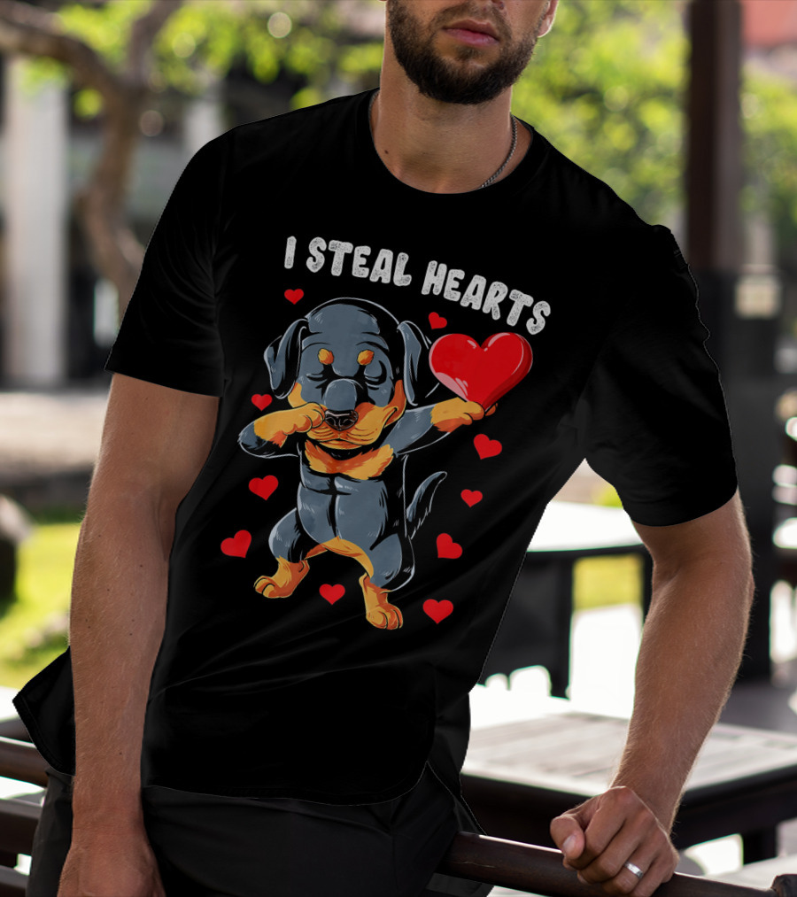 Dabbing Rottweiler Holding Heart Surrounded By I Steal Hearts Text T-Shirt