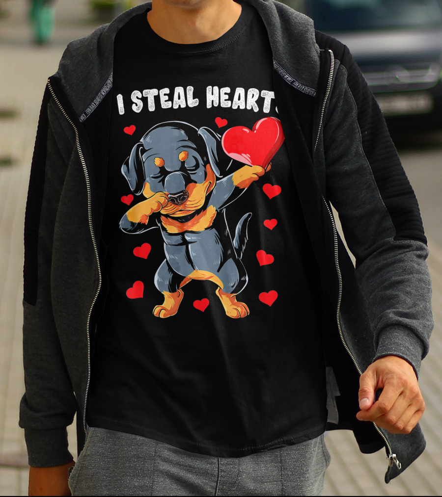 Dabbing Rottweiler Holding Heart Surrounded By I Steal Hearts Text T-Shirt