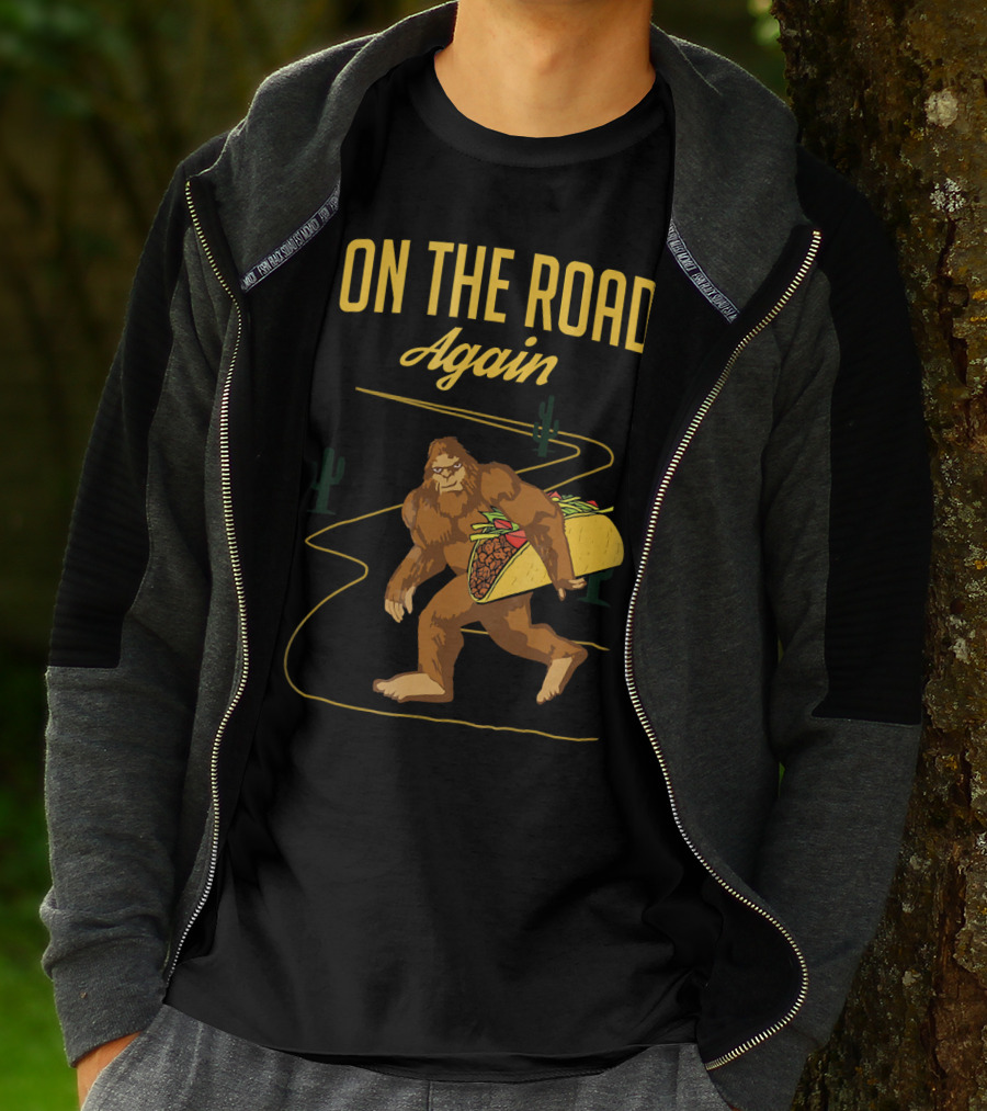 ON THE ROAD AGAIN Smirk Bigfoot Sasquatch Carrying Taco T-Shirt