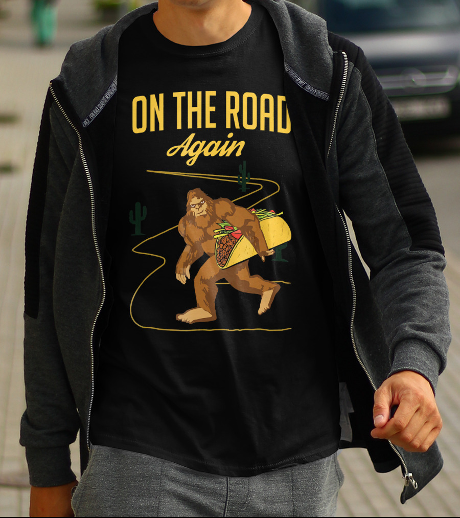 ON THE ROAD AGAIN Smirk Bigfoot Sasquatch Carrying Taco T-Shirt