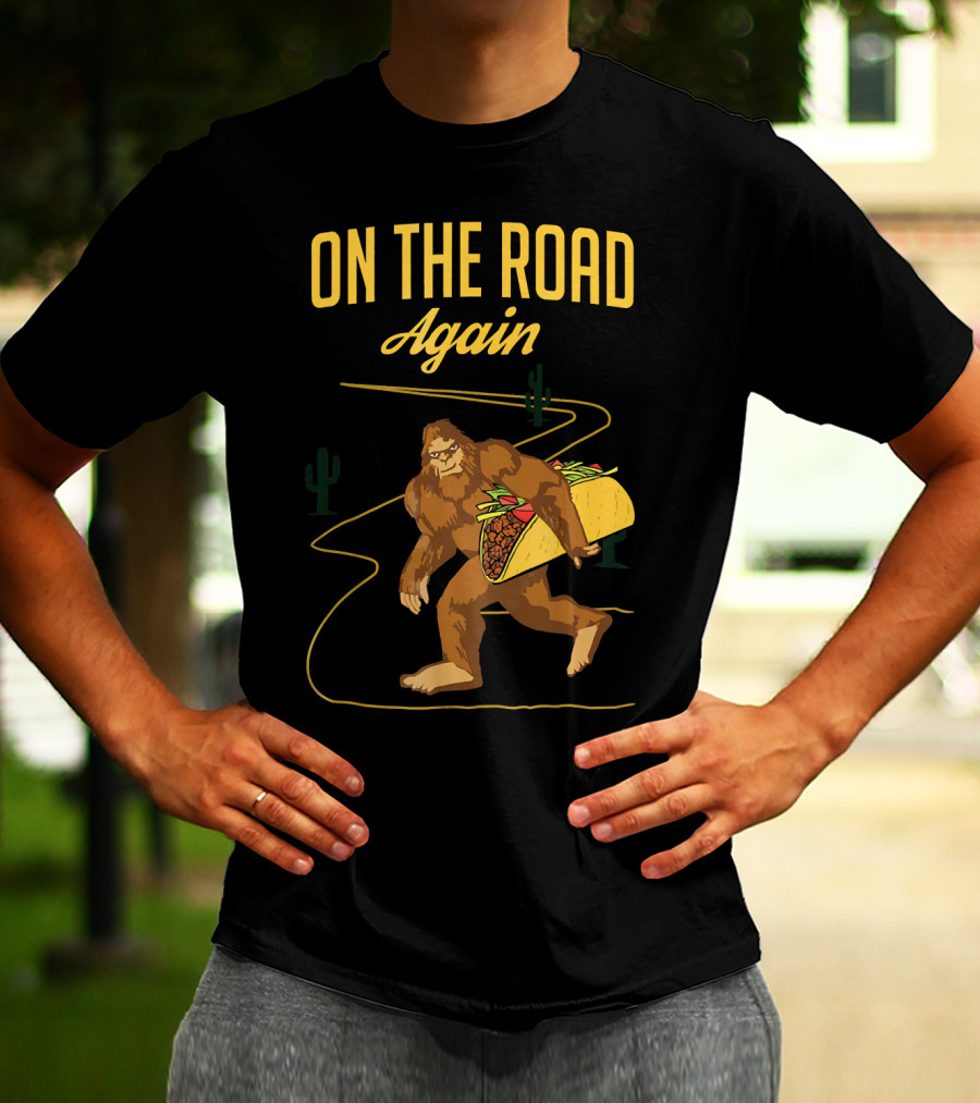 ON THE ROAD AGAIN Smirk Bigfoot Sasquatch Carrying Taco T-Shirt