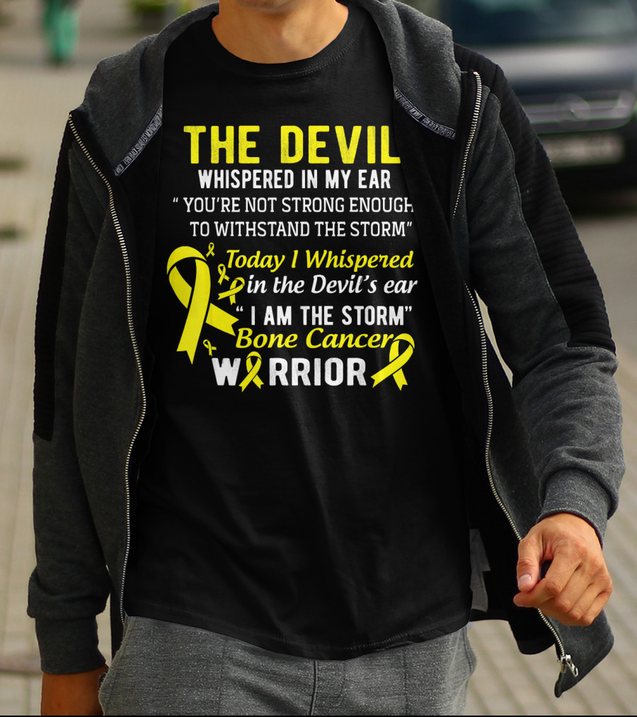 The Devil Whispered You’re Not Strong Enough To Withstand The Storm I Am The Storm Bone Cancer Warrior Yellow T-Shirt