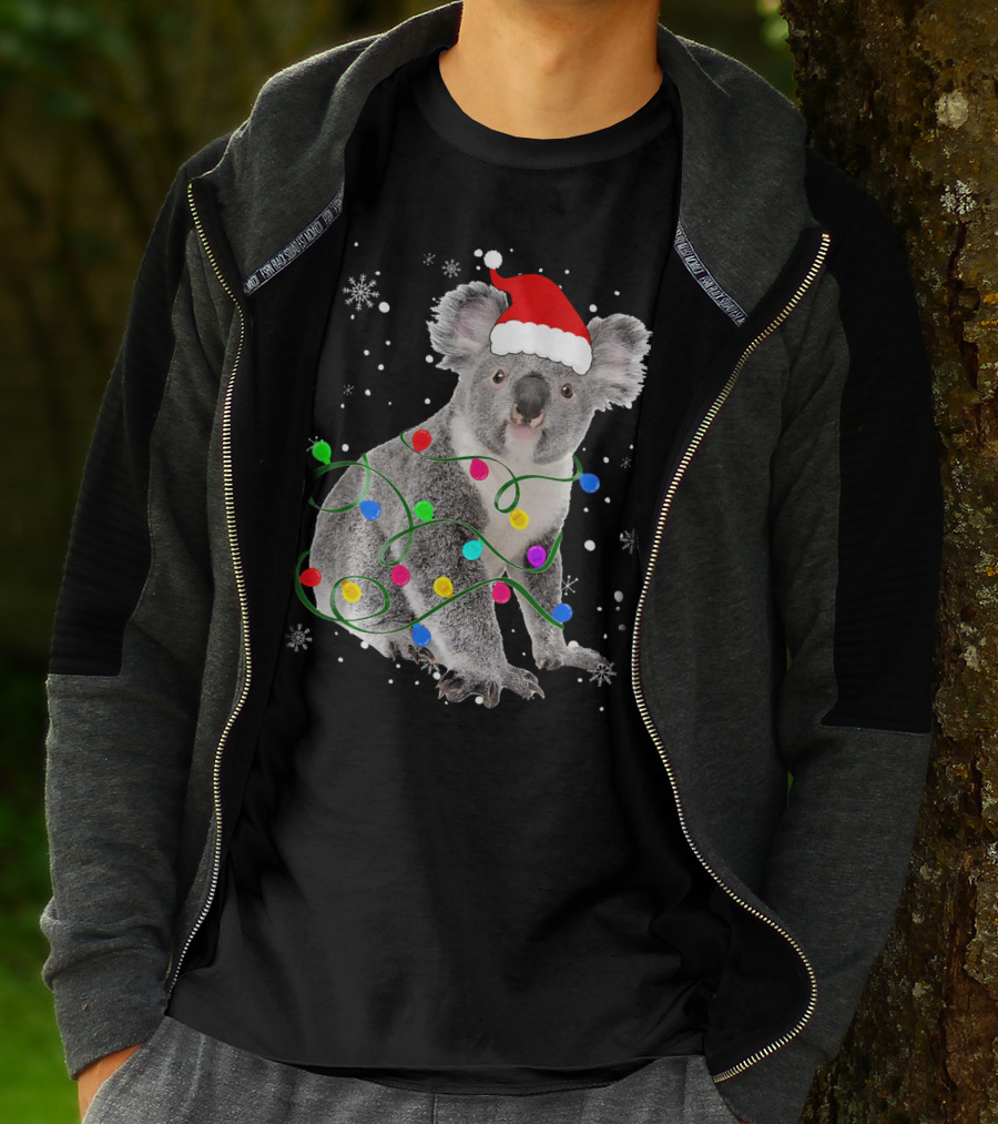 Koala Wrapped In Christmas Lights Wearing Santa Hat With Snowflakes Matching Fam T-Shirt