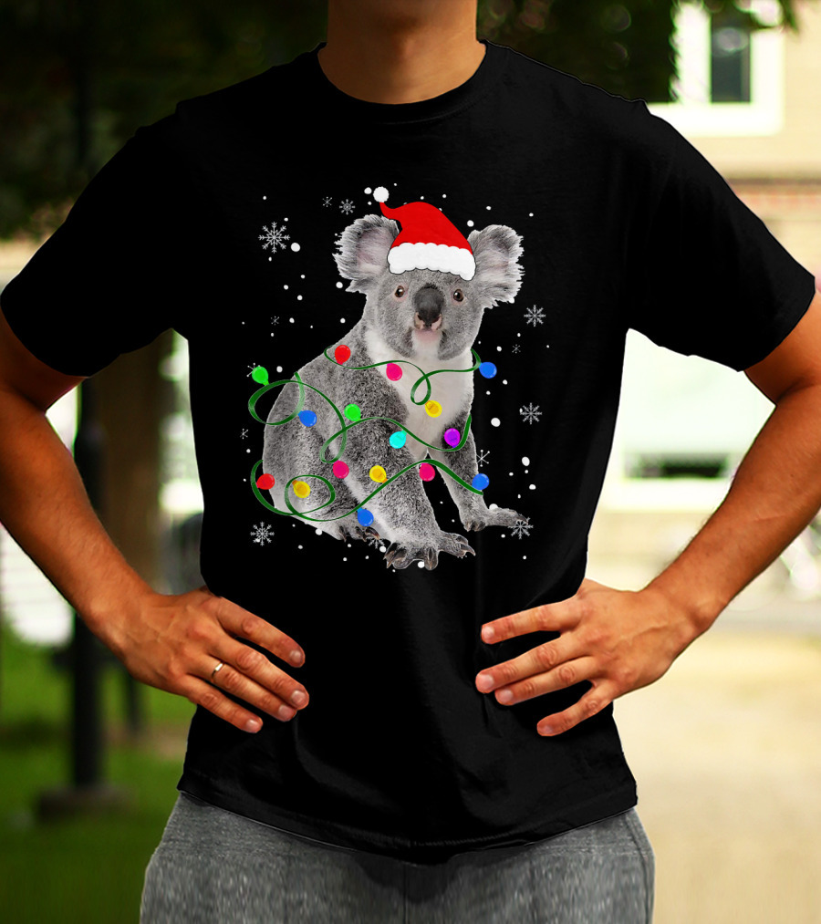 Koala Wrapped In Christmas Lights Wearing Santa Hat With Snowflakes Matching Fam T-Shirt