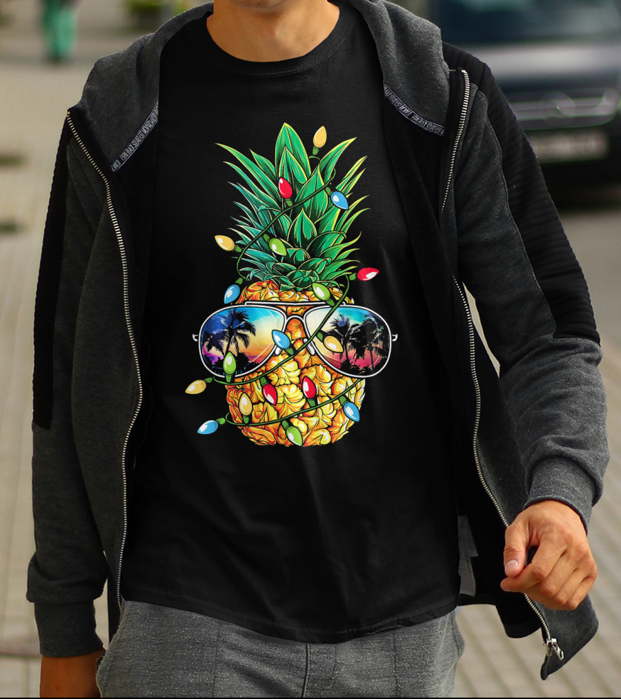 Pineapple Wrapped In Christmas Lights With Sunglasses Reflected Sunset And Palm Trees T-Shirt