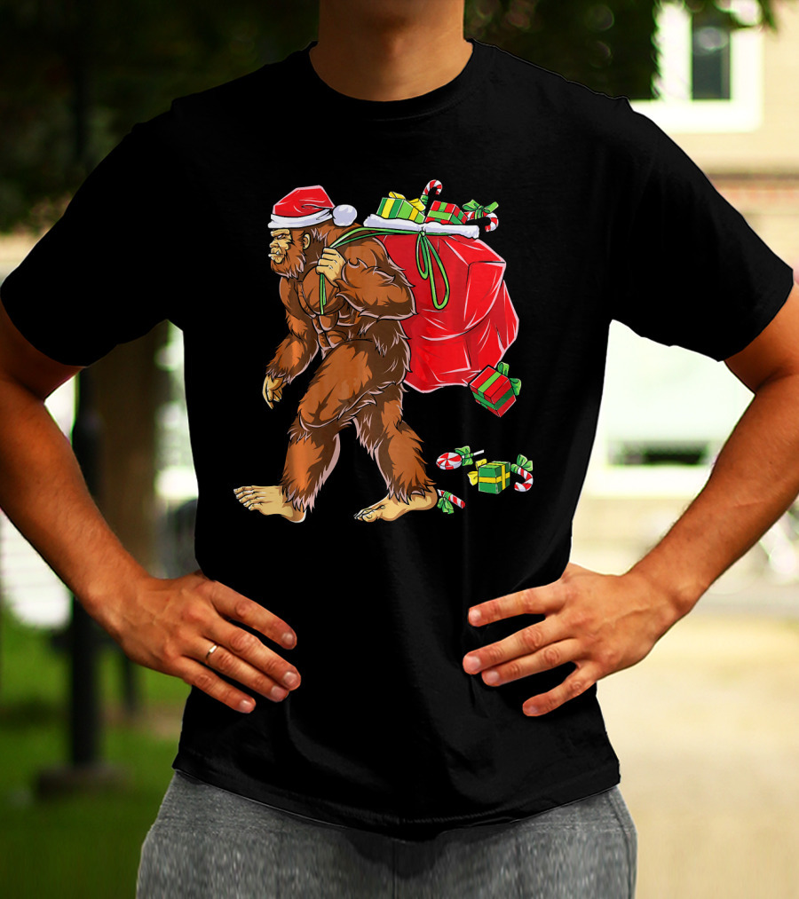 Bigfoot Santa Carrying Gifts With Candy Canes T-Shirt