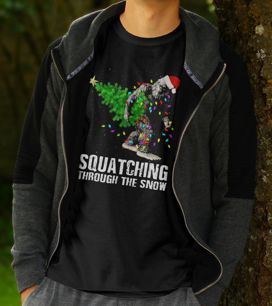 Squatching Through The Snow Bigfoot Christmas Lights Santa Hat T-Shirt