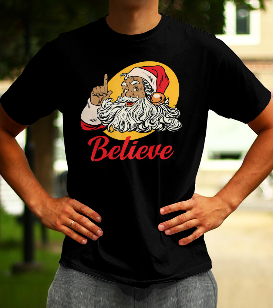 Black Santa Claus With Believe Caption And Yellow Background T-Shirt