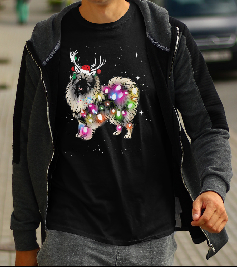 Keeshond Dog Wrapped In Christmas Lights Wearing Red Santa Hat And Antlers T-Shirt