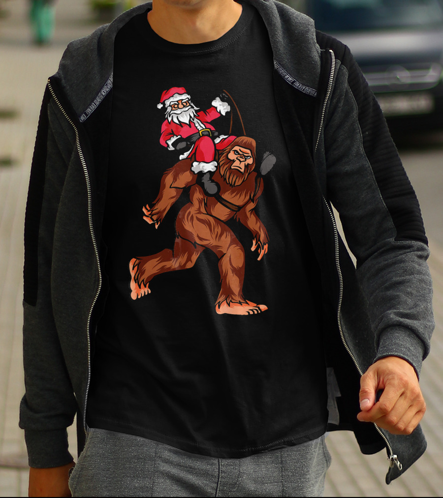 Bigfoot Carrying Santa Claus In Christmas T-Shirt