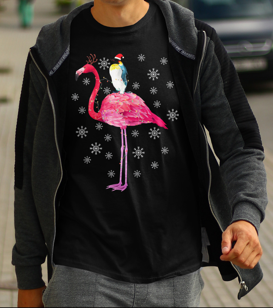 Penguin With Santa Hat Riding Flamingo With Antlers Surrounded By Snowflakes T-Shirt