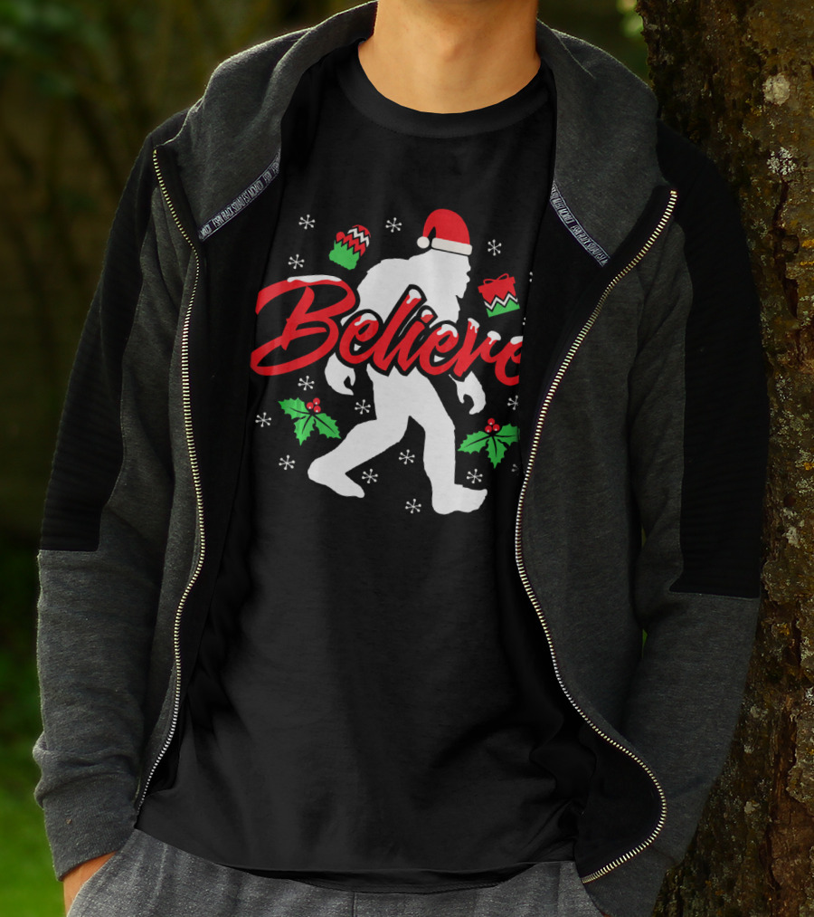 Believe Bigfoot Christmas Santa Hat Snowflakes Holly T-Shirt